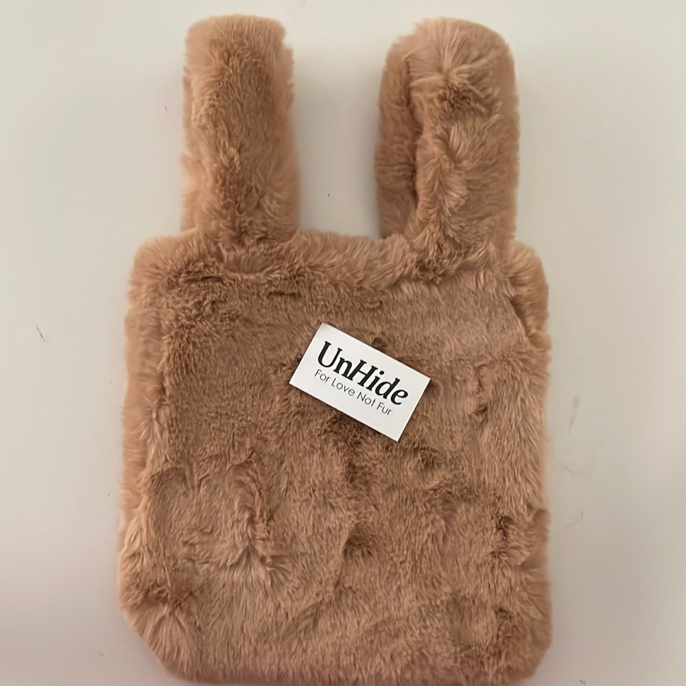 Brand new, never used Unhide faux fur bag.